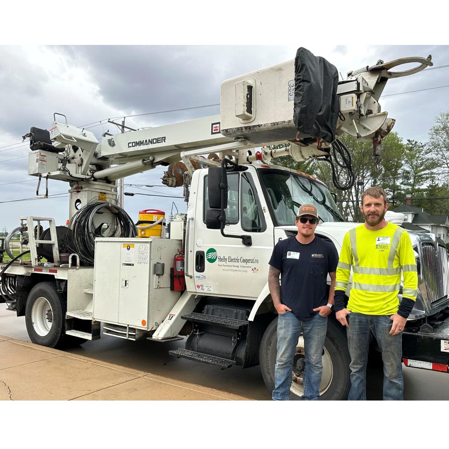 linemen with truck outside